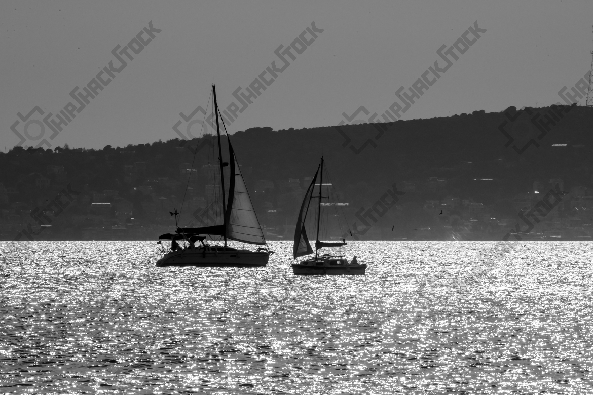 Sun reflections and sailboats